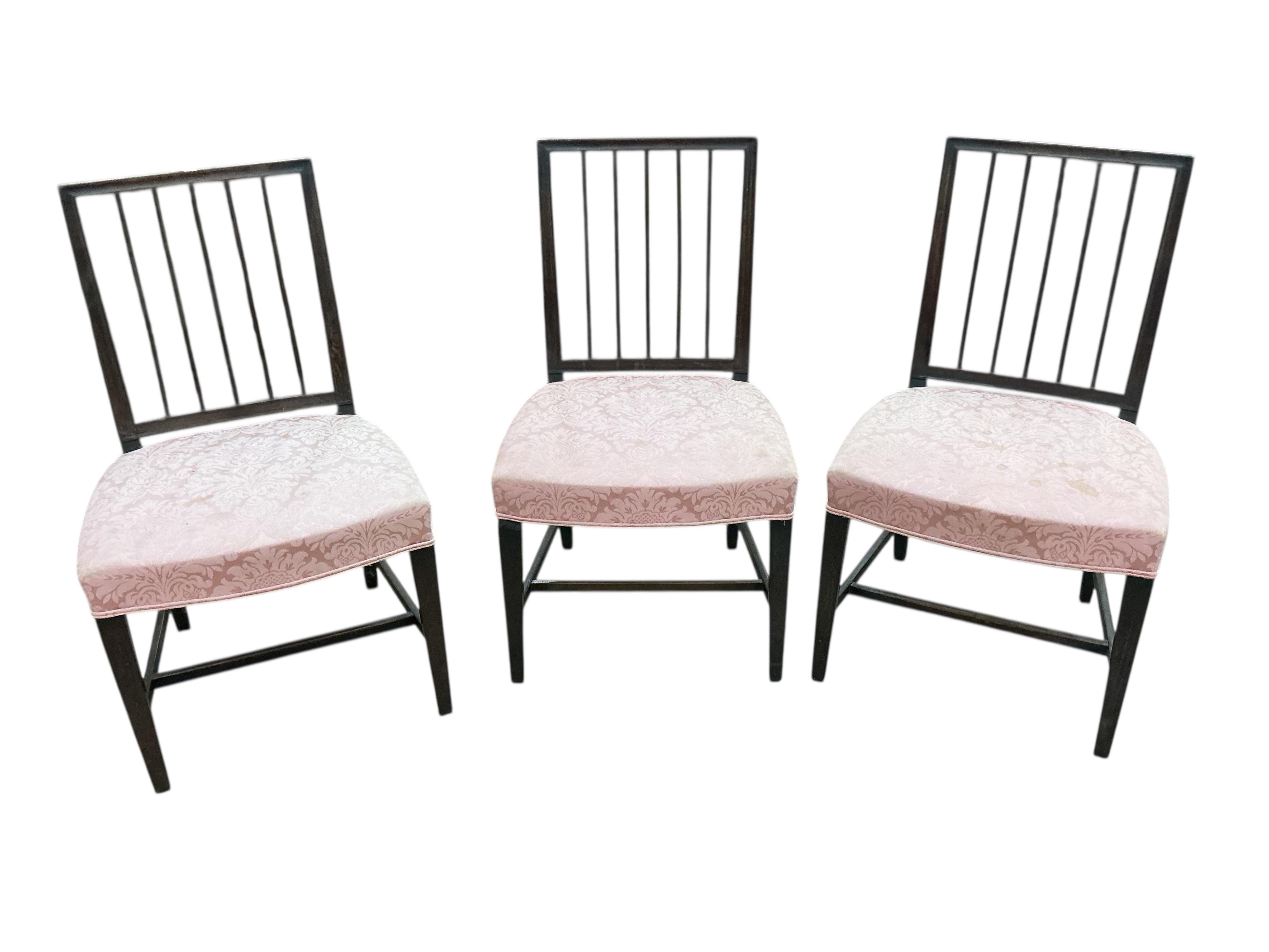 A set of six George III mahogany dining chairs, one with arms